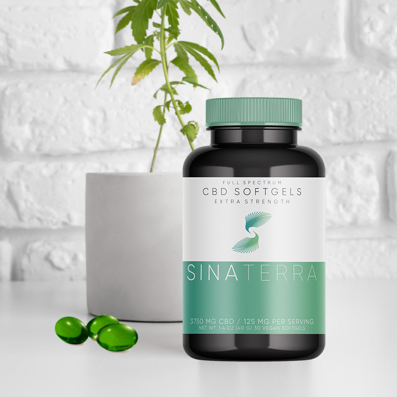 Image of CBD Supplement bottle with medicinal plant and green softgel composition